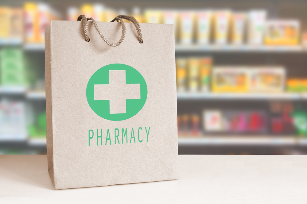 recyclable paper bag labeled pharmacy in a drug store