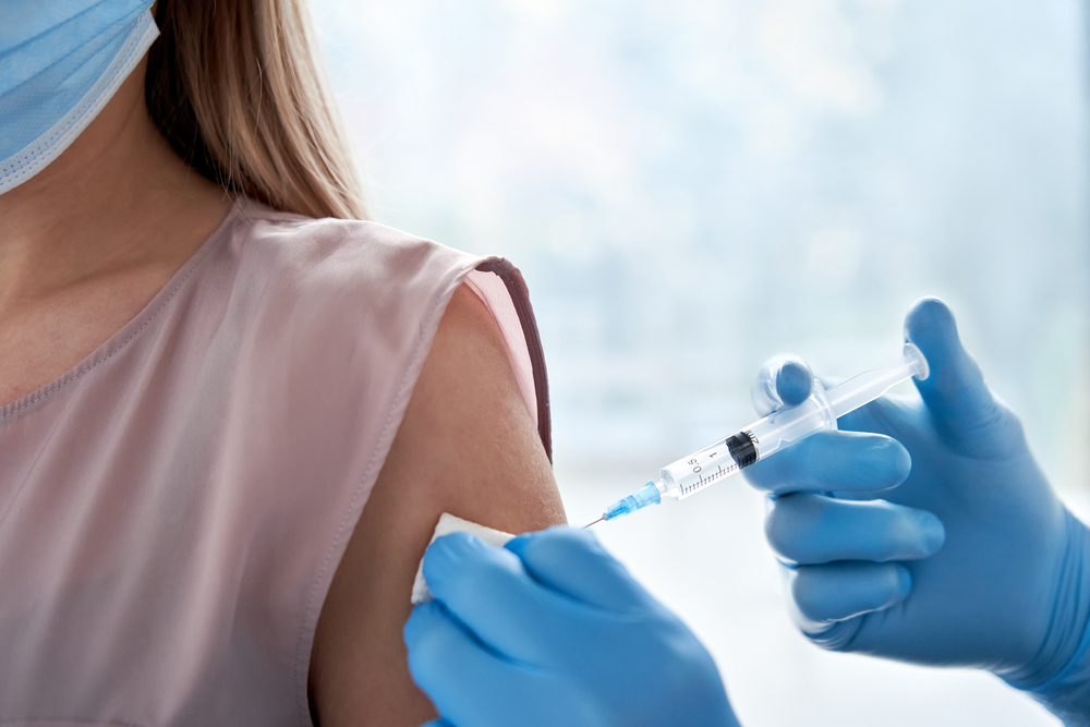 woman receiving vaccine in arm