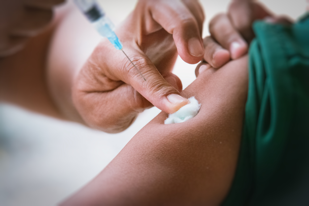 close up of vaccination shot in arm